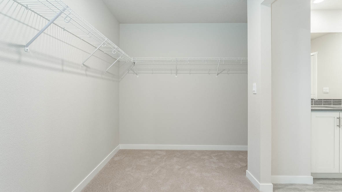 Avery Terrace walk in closet with white wire shelving
