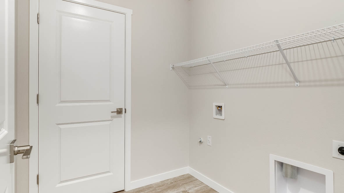 Avery Terrace laundry room with white wire shelving