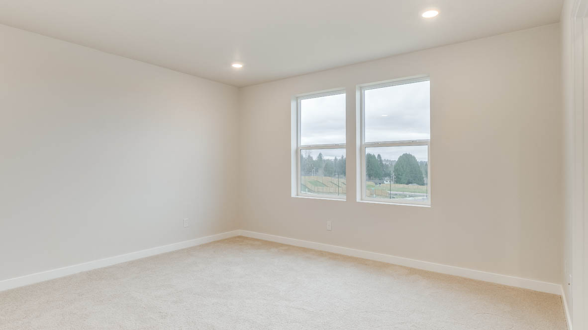 Avery Terrace primary bedroom with carpet, windows, and white walls