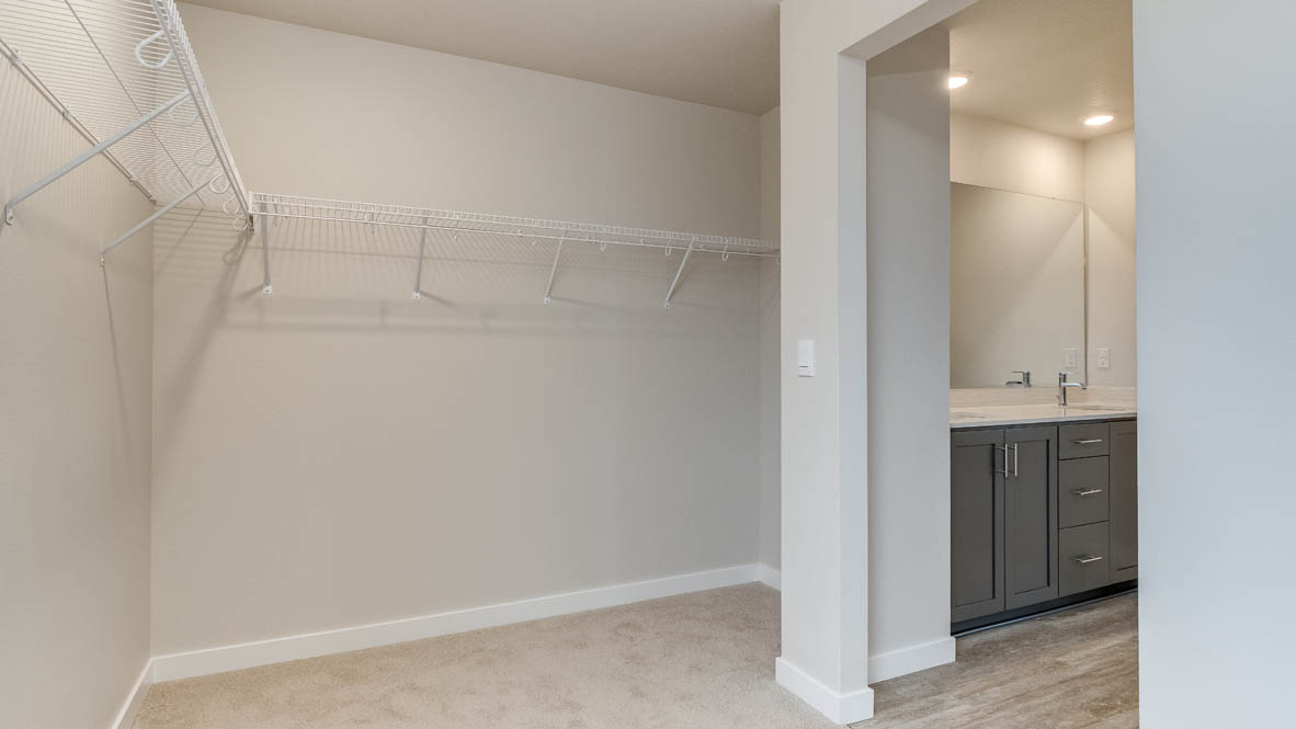 Avery Terrace walk in closet with white wire shelving
