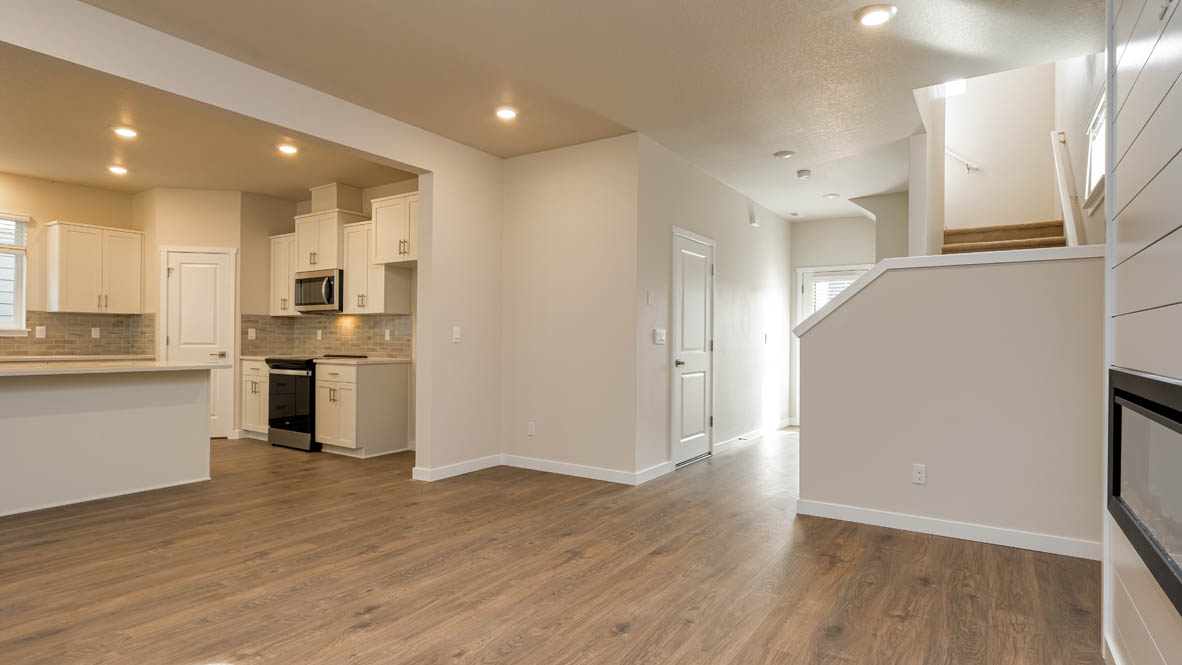Great room with laminate flooring and an electric fireplace