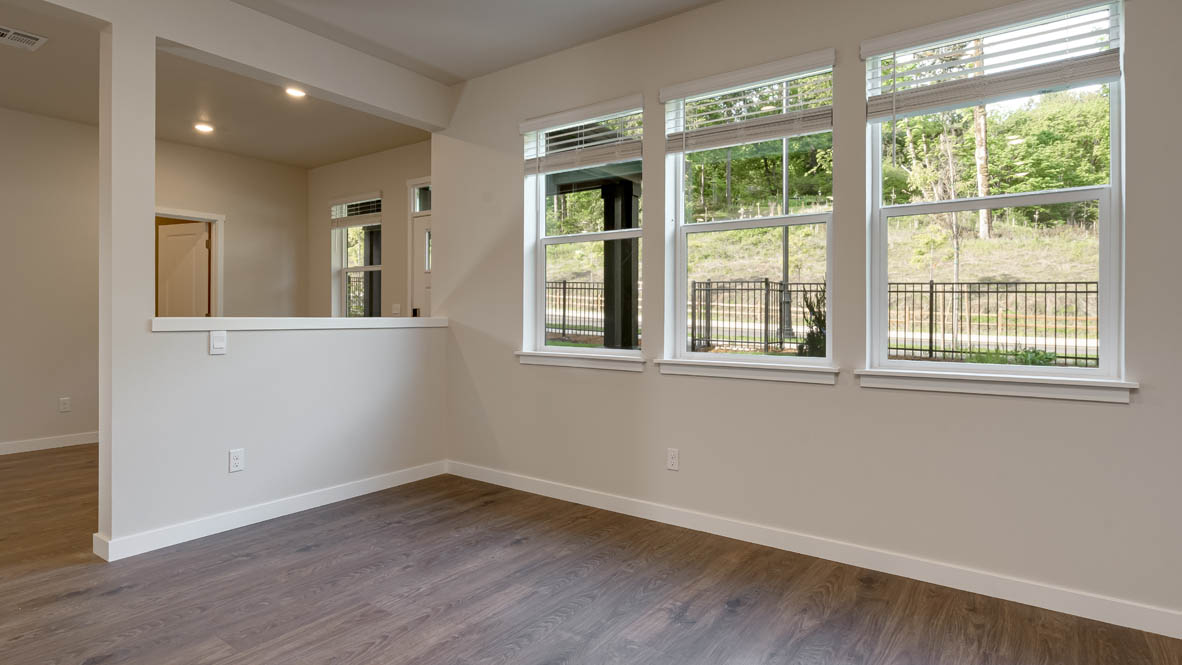 Great room with laminate flooring and an electric fireplace