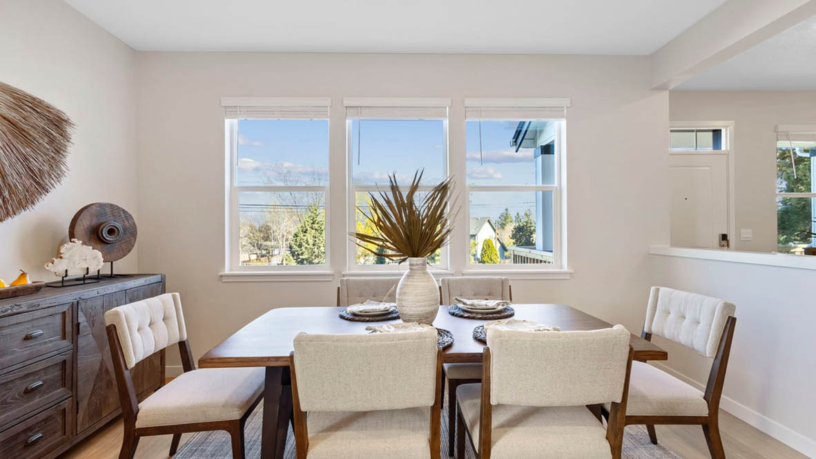 Avery Terrace Dining Room with four chairs, a table, a plant, sliding glass door, hanging decorations, a side table, a console table with plants and a mirror