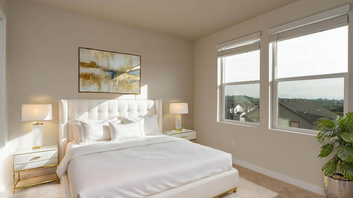 Avery Terrace bedroom with a queen sized bed and carpeting