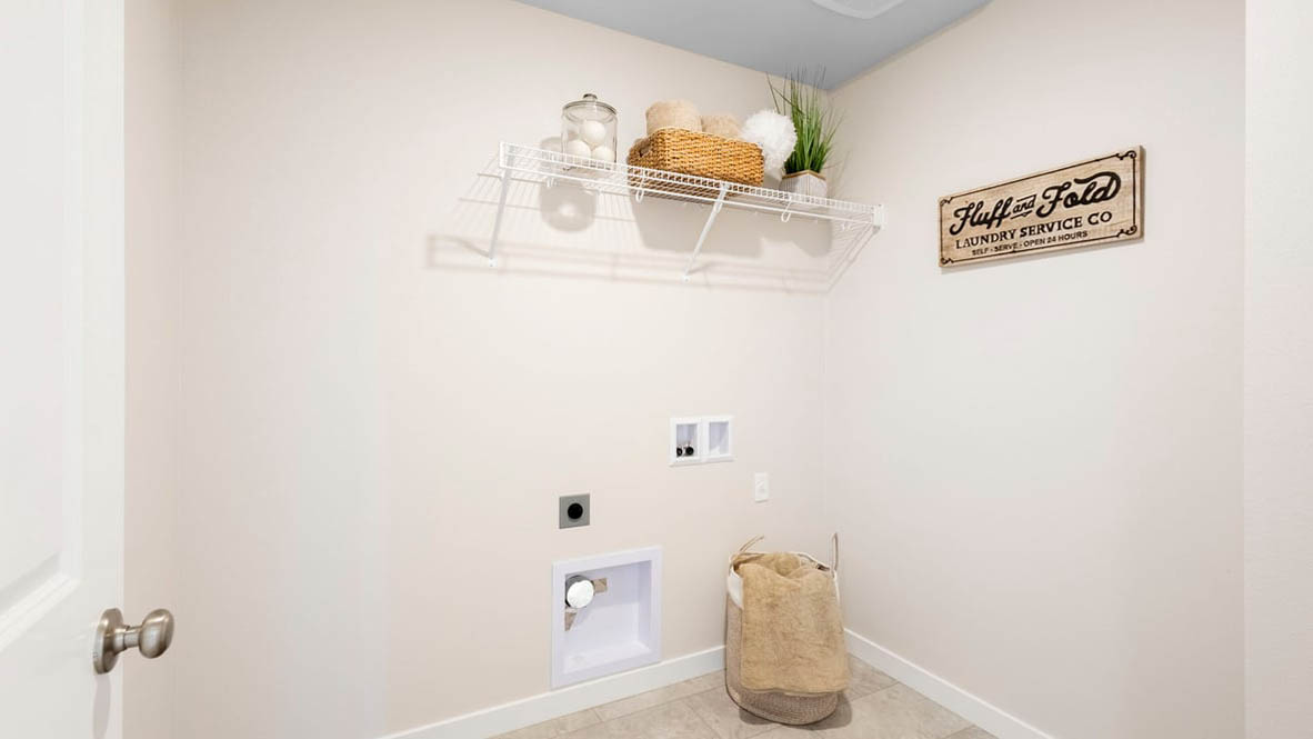 Avery Terrace Laundry Room with white wire shelving, a window