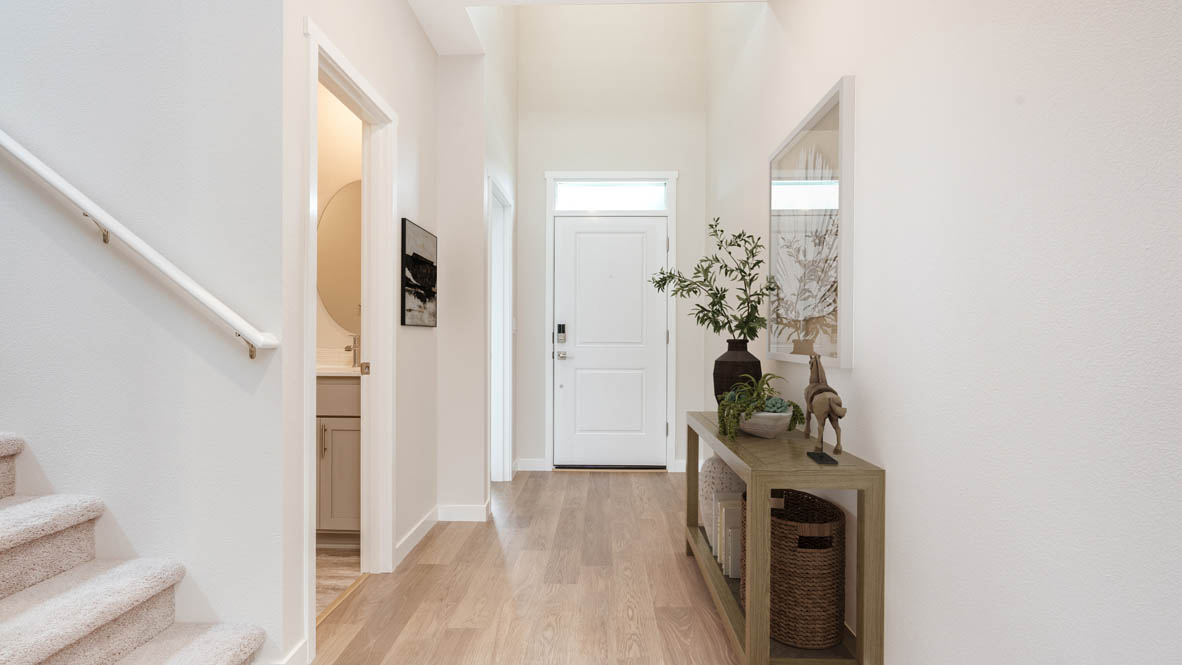 Avery Terrace hallway with entry table and front door