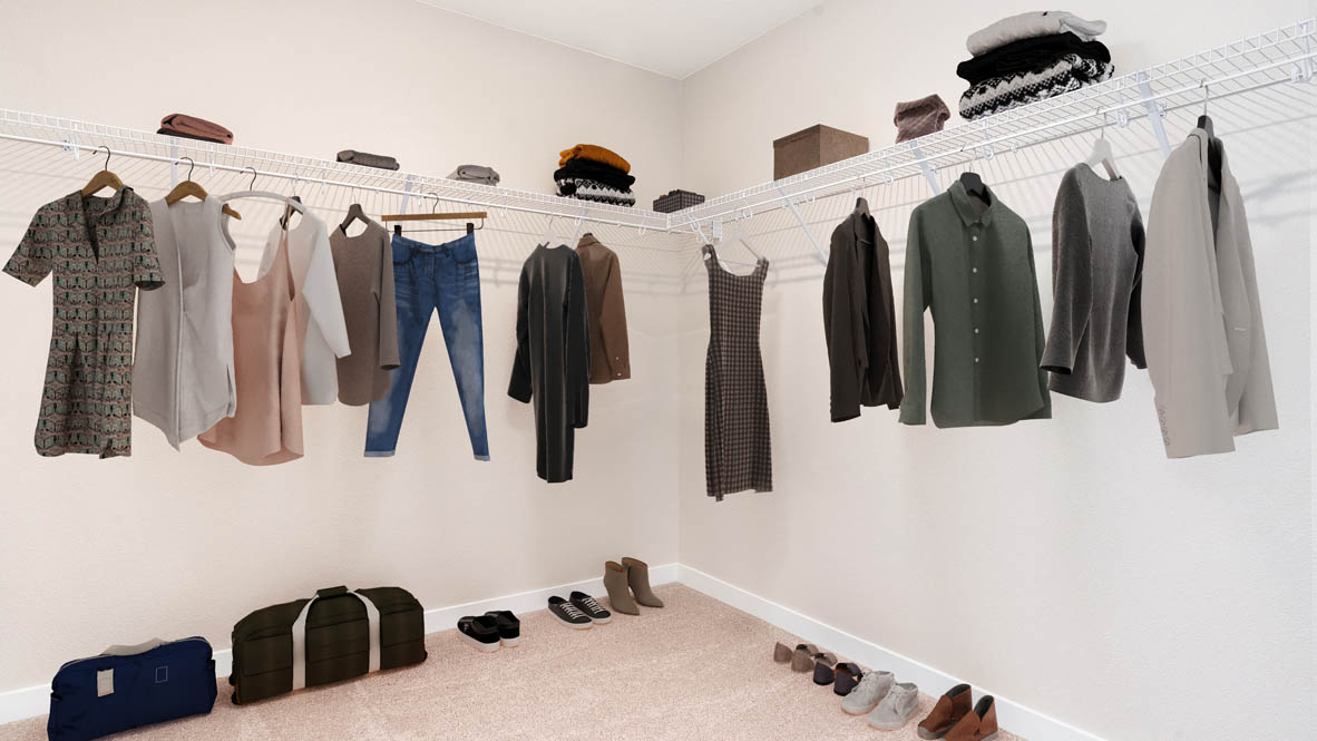 Avery Terrace walk in closet with close hanging from white wire shelves
