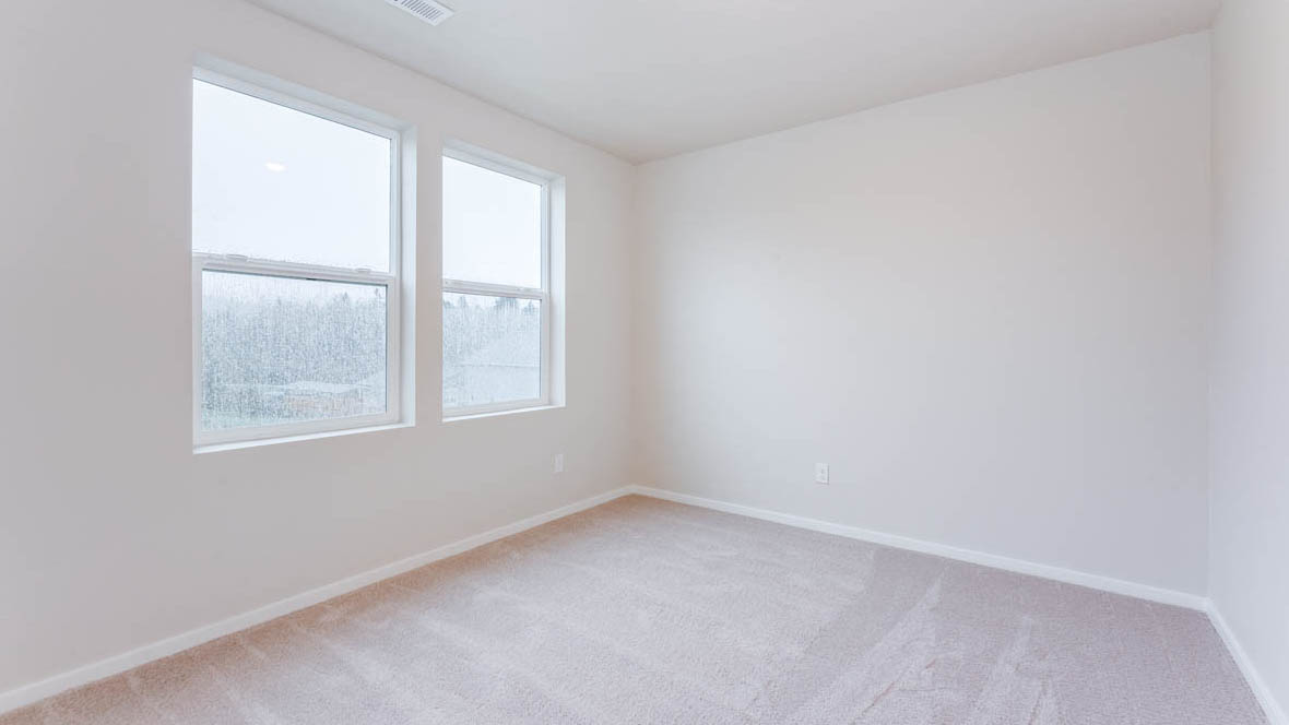 Avery Terrace Bedroom with carpet, white walls, and a window