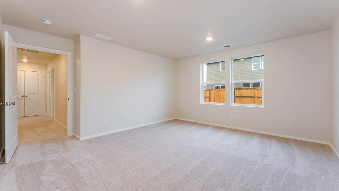 Avery Terrace bedroom with carpet, windows, and white walls
