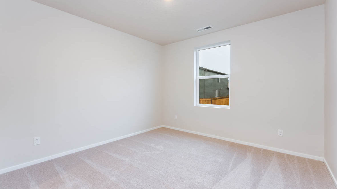 Avery Terrace Bedroom with carpet, white walls, and a window