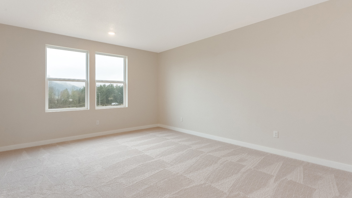 Avery Terrace primary bedroom with two windows, carpet, and walls
