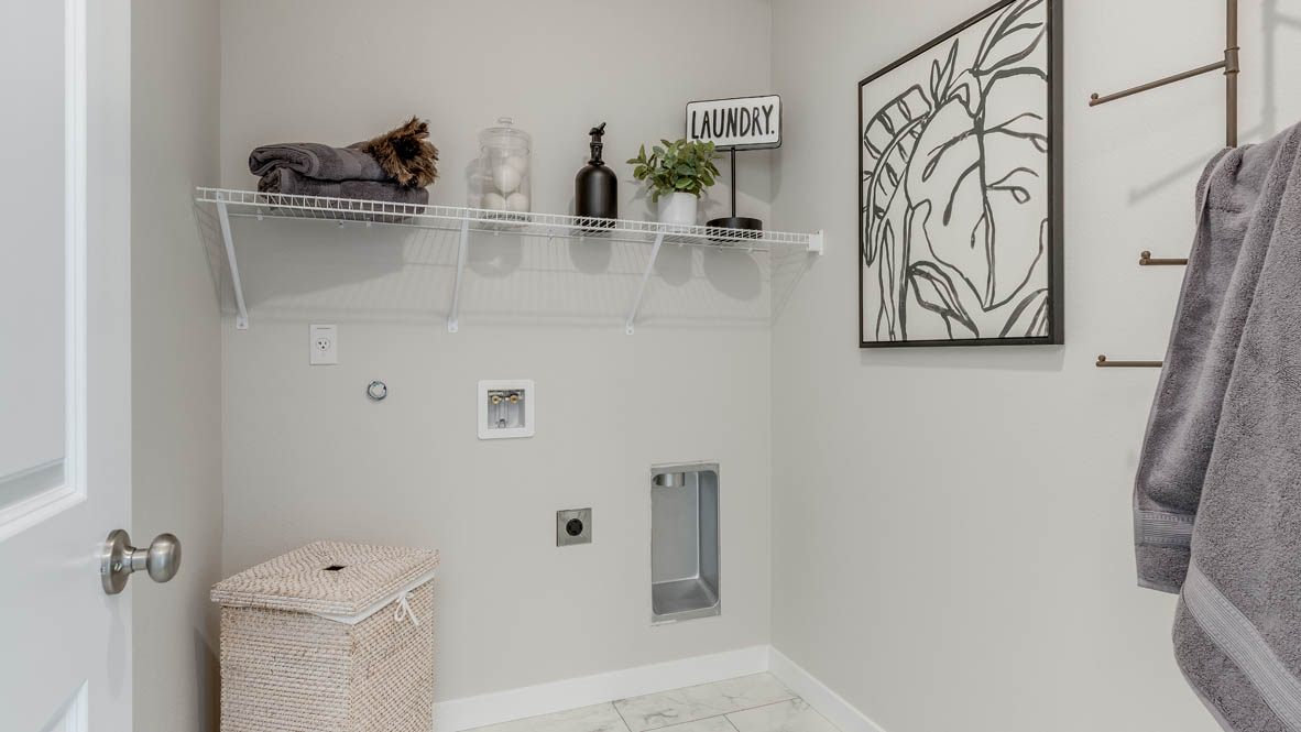 Gordon Creek Pointe laundry room with white wire shelving