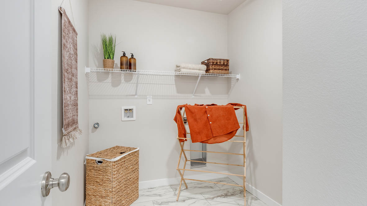 Gordon Creek Pointe laundry room with white wire shelving