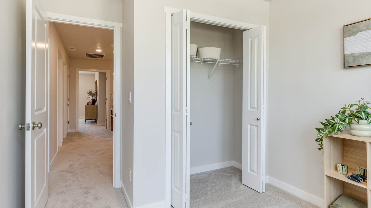 Gordon Creek Pointe Bedroom with carpet, closet, and cupboards