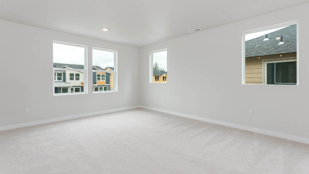 Gordon Creek Pointe Primary bedroom with windows, carpet, and white walls