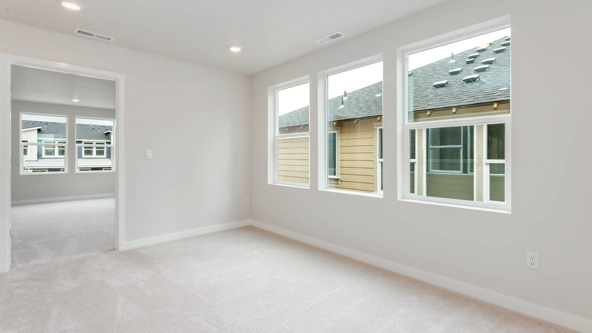 Gordon Creek Pointe loft with carpet, windows, and white walls