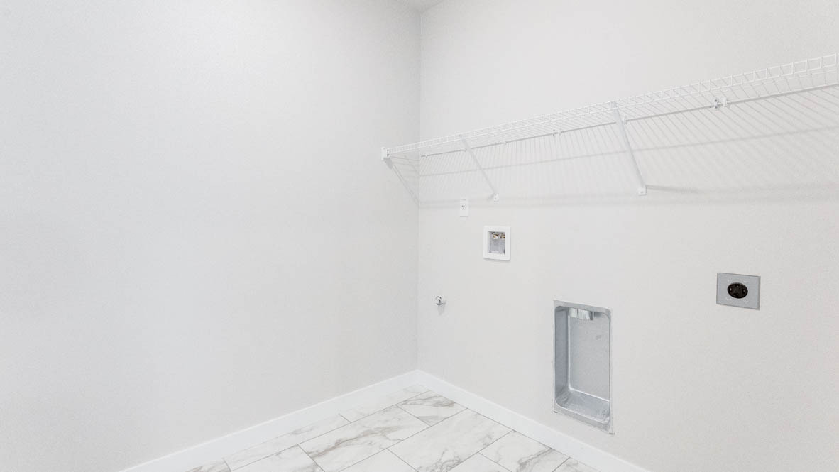 Gordon Creek Pointe laundry room with white wire shelving