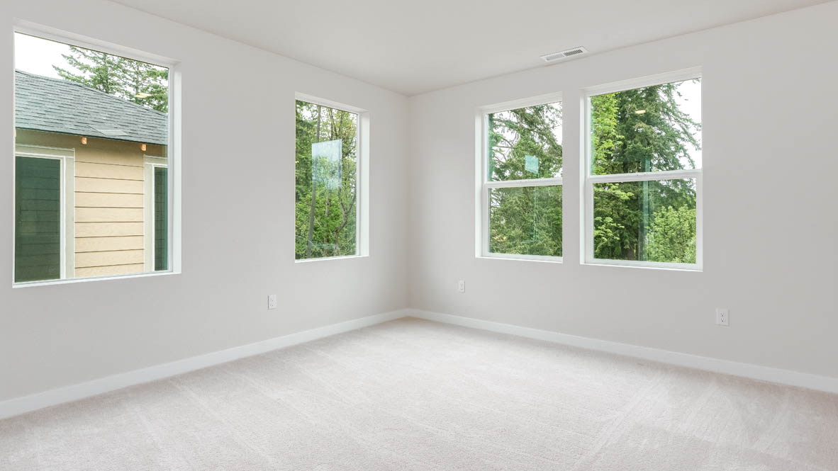Gordon Creek Pointe bedroom with windows, carpet, and white walls