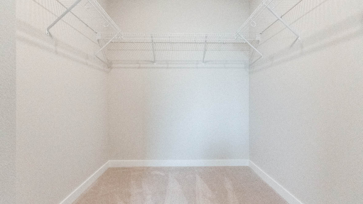 Gordon Creek Pointe walk in closet with white wire shelving