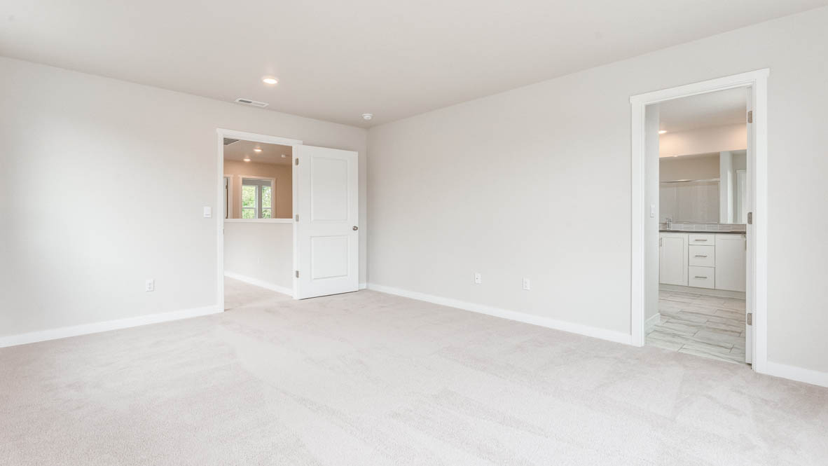 Gordon Creek Pointe Primary Bedroom with carpet, closet, and white walls