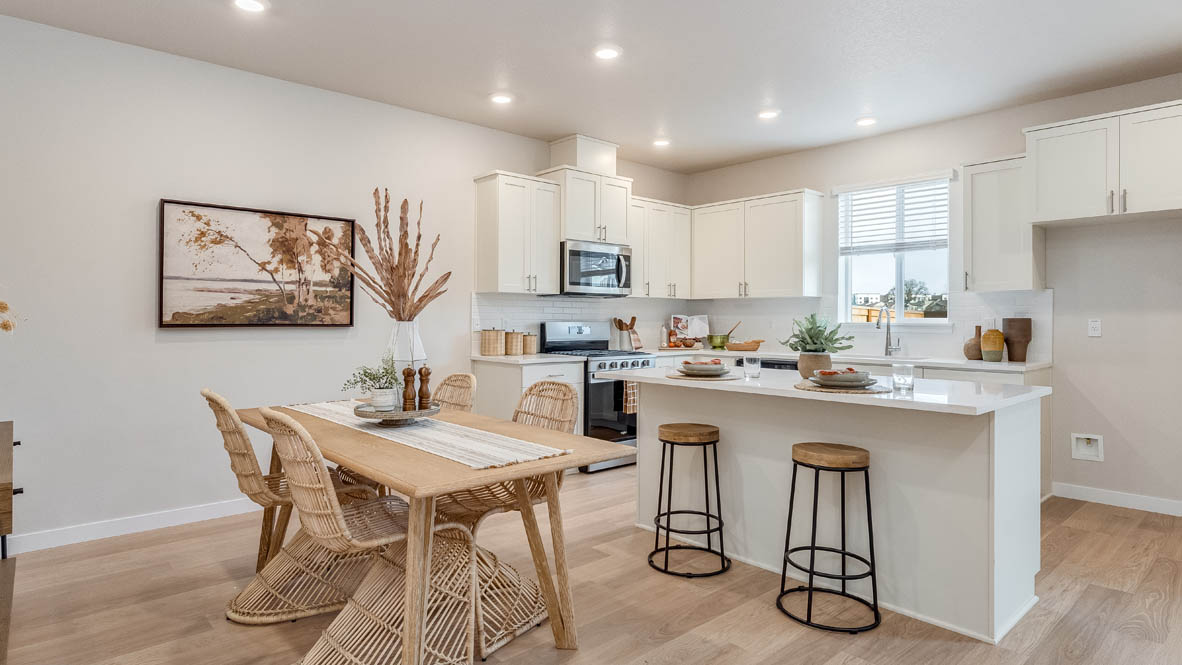 Gordon Creek Pointe kitchen with white shaker style cabinets and solid surface countertopsGordon Creek Pointe kitchen with white shaker style cabinets and solid surface countertops