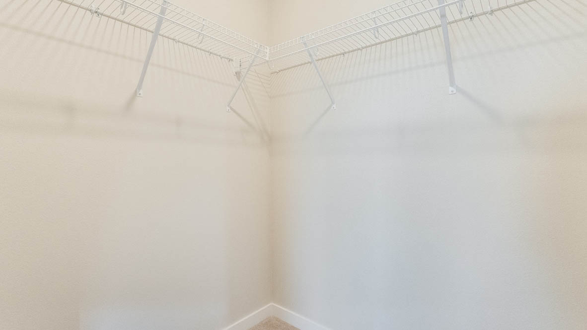Gordon Creek Pointe closet walk in closet with white wire shelving
