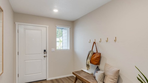 Blue Pearl Entryway with bench seat and coat hooks