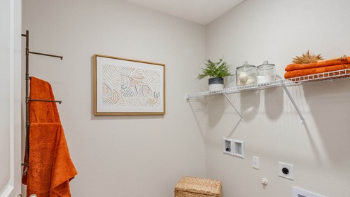 Blue Pearl Laundry room with white wire shelving
