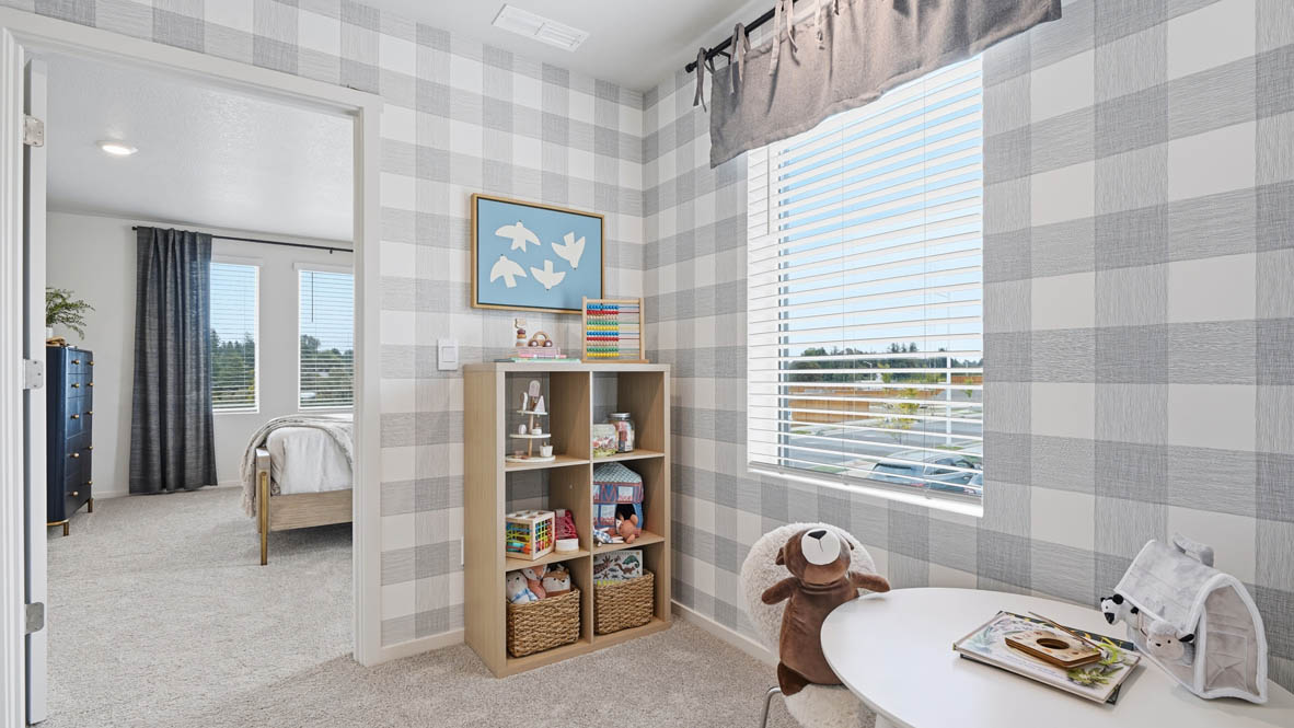 Bedroom with wall-to-wall carpet and a closet
