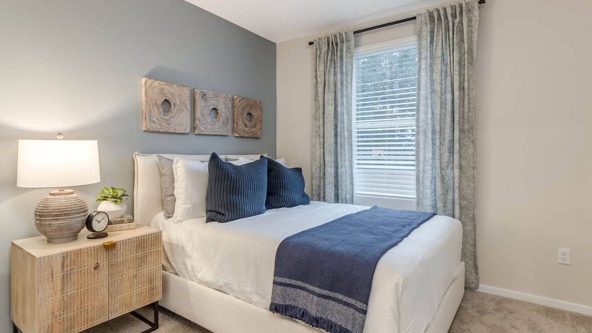 Blue Pearl Bedroom with a bed, carpet, and closet