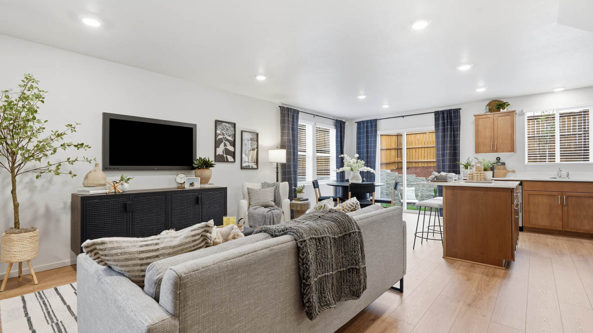 Great room with laminate flooring and an electric fireplace