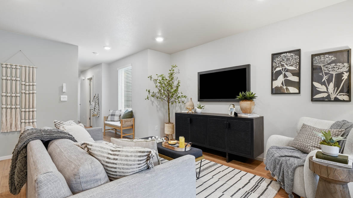 Great room with laminate flooring and an electric fireplace