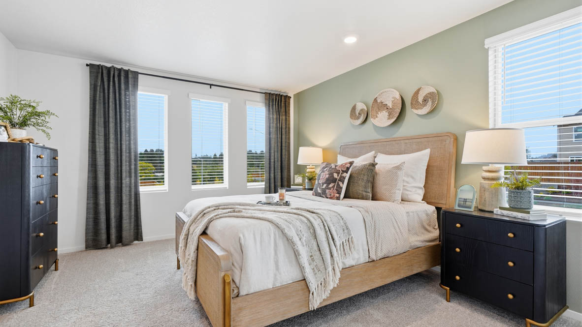 Primary bedroom with wall-to-wall carpet, a walk-in closet and an attached bathroom