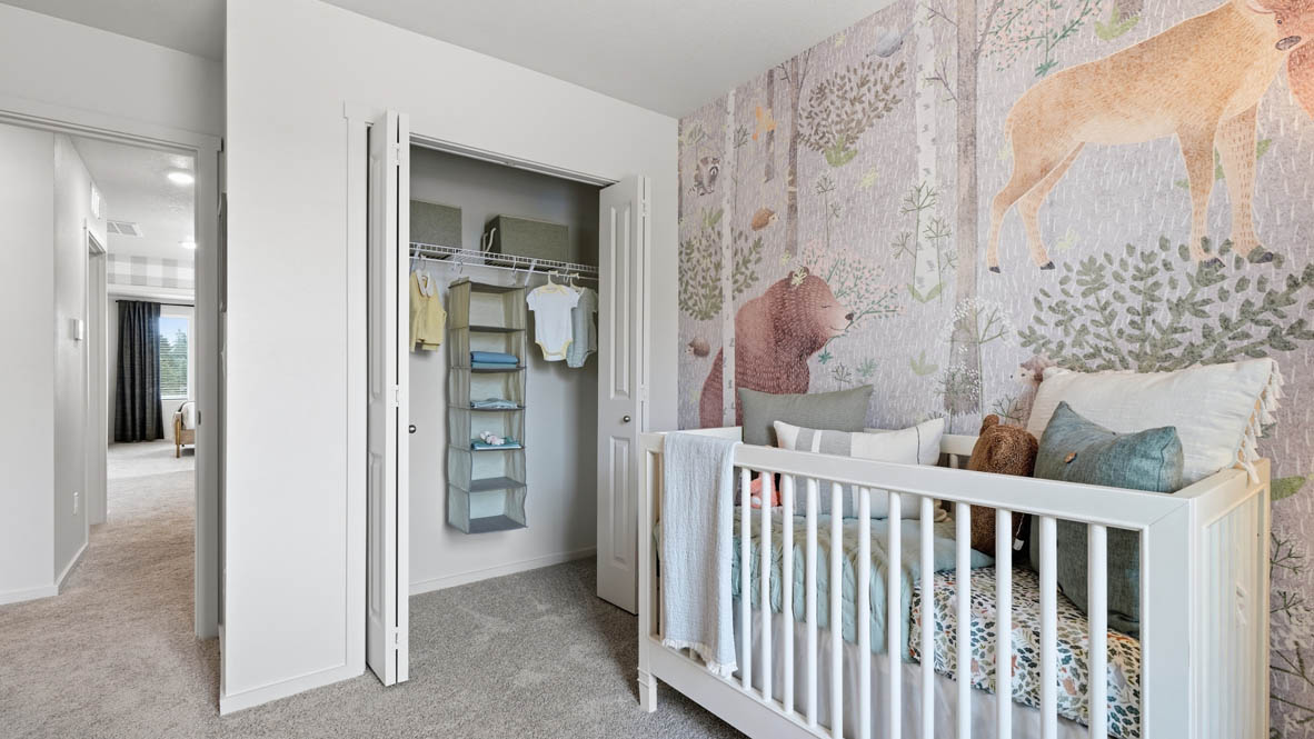 Bedroom with wall-to-wall carpet and a closet