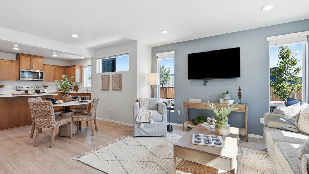 Thunder Ridge dining room with wooden table and chairs set for four next to the kitchen