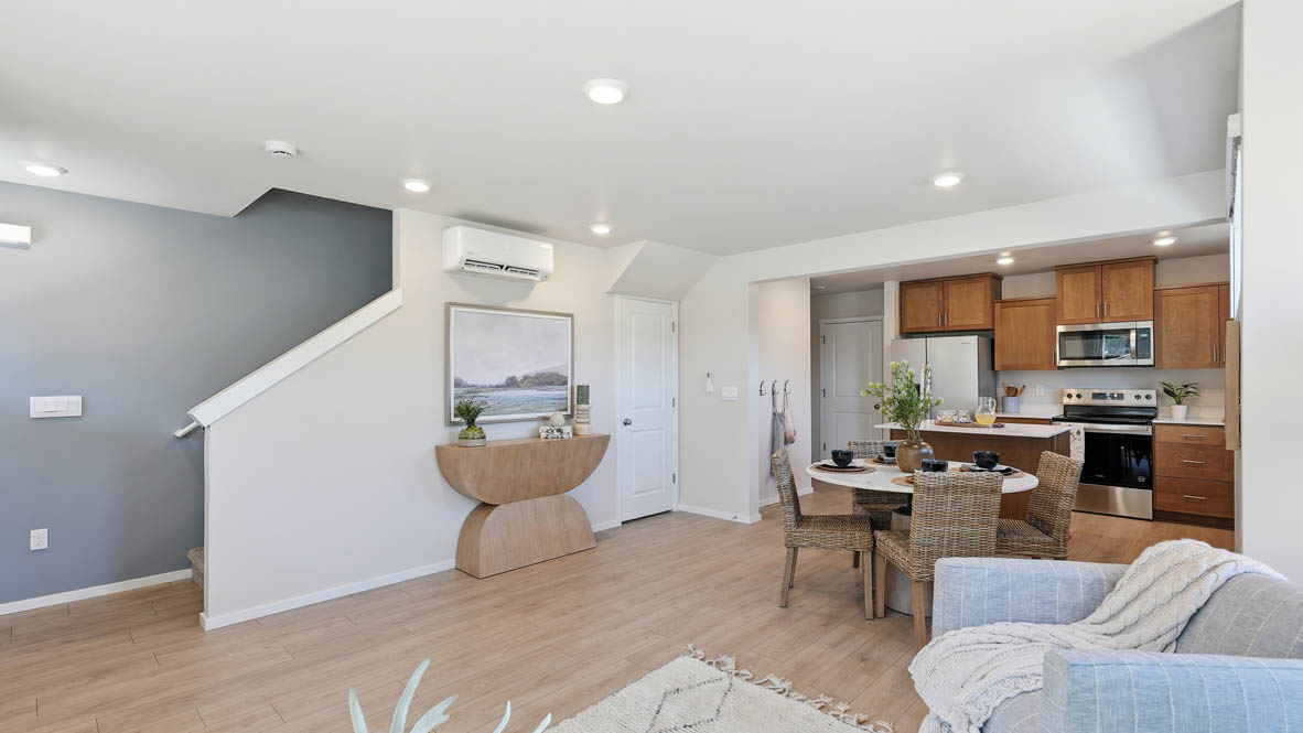 Thunder Ridge dining room with wooden table and chairs set for four next to the kitchen