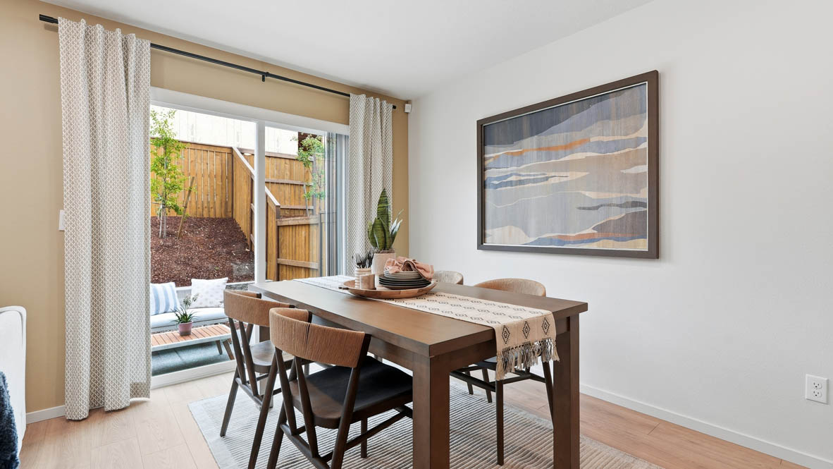 Thunder Ridge dining room with sliding door, laminate flooring, and table