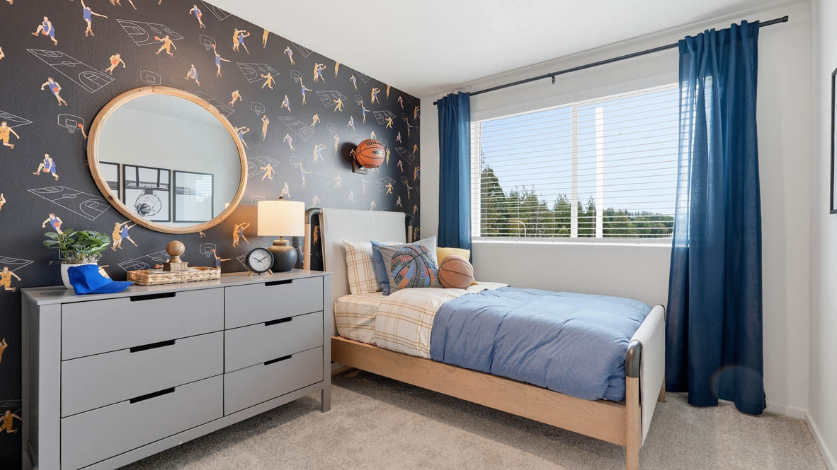 Thunder Ridge bedroom with accent wall, window, carpet and gray furniture