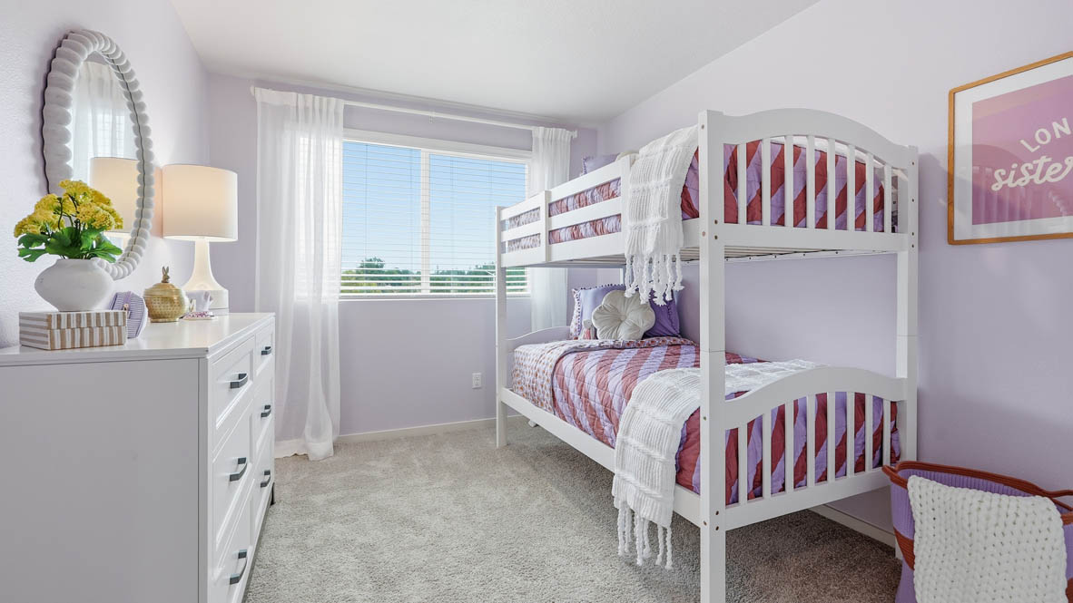 Thunder Ridge bedroom with pink walls, white furniture, window, and carpet