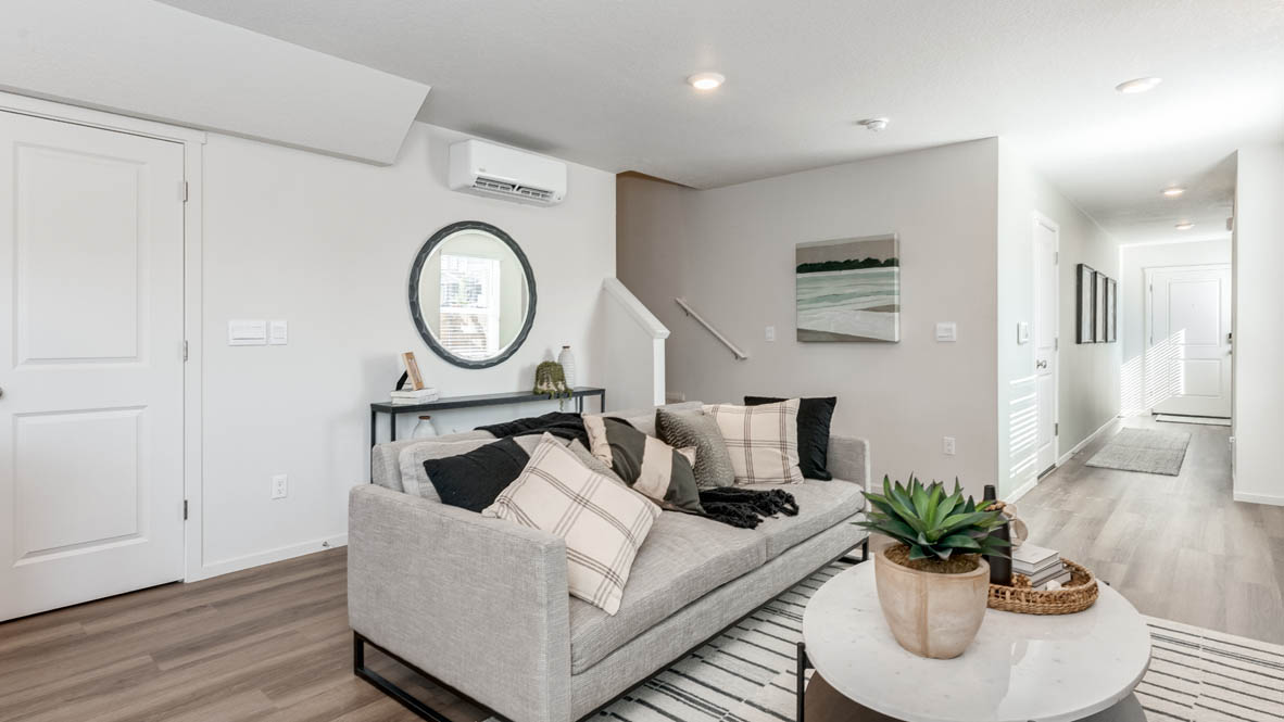 Thunder Ridge Great Room with couches and Hallway in the background