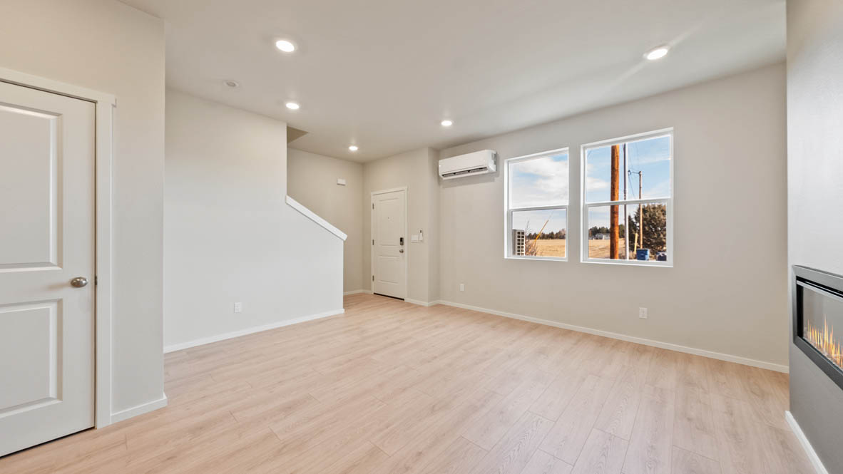 Ponderosa great room with lvt flooring and windows and fireplace