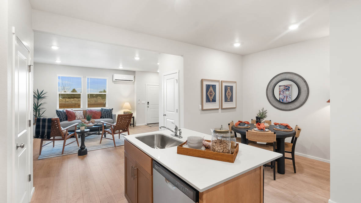 Ponderosa kitchen with stained shaker style cabinets and brushed nickel pulls with solid surface countertops and stainless steel appliances