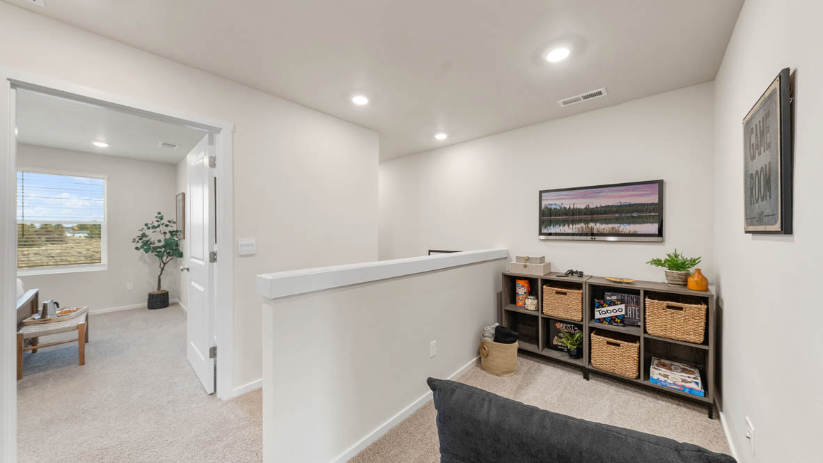 Ponderosa tech niche with a hanging painting, carpet, and a seat