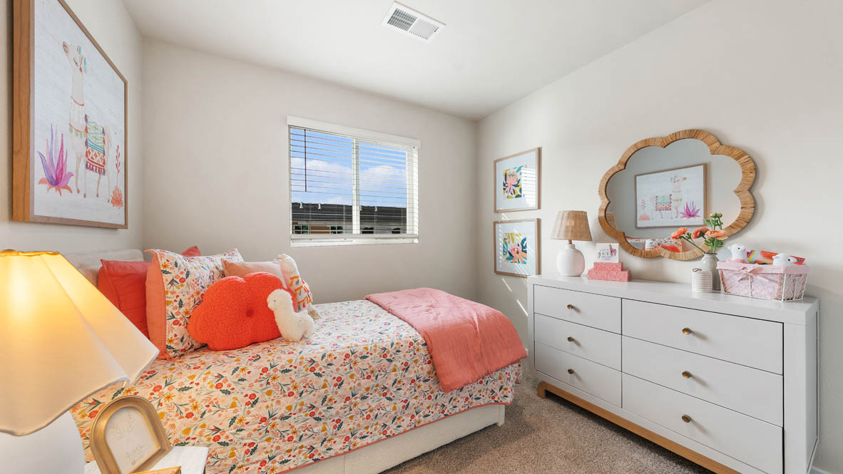 Ponderosa bedroom with red and blue accents with carpeting