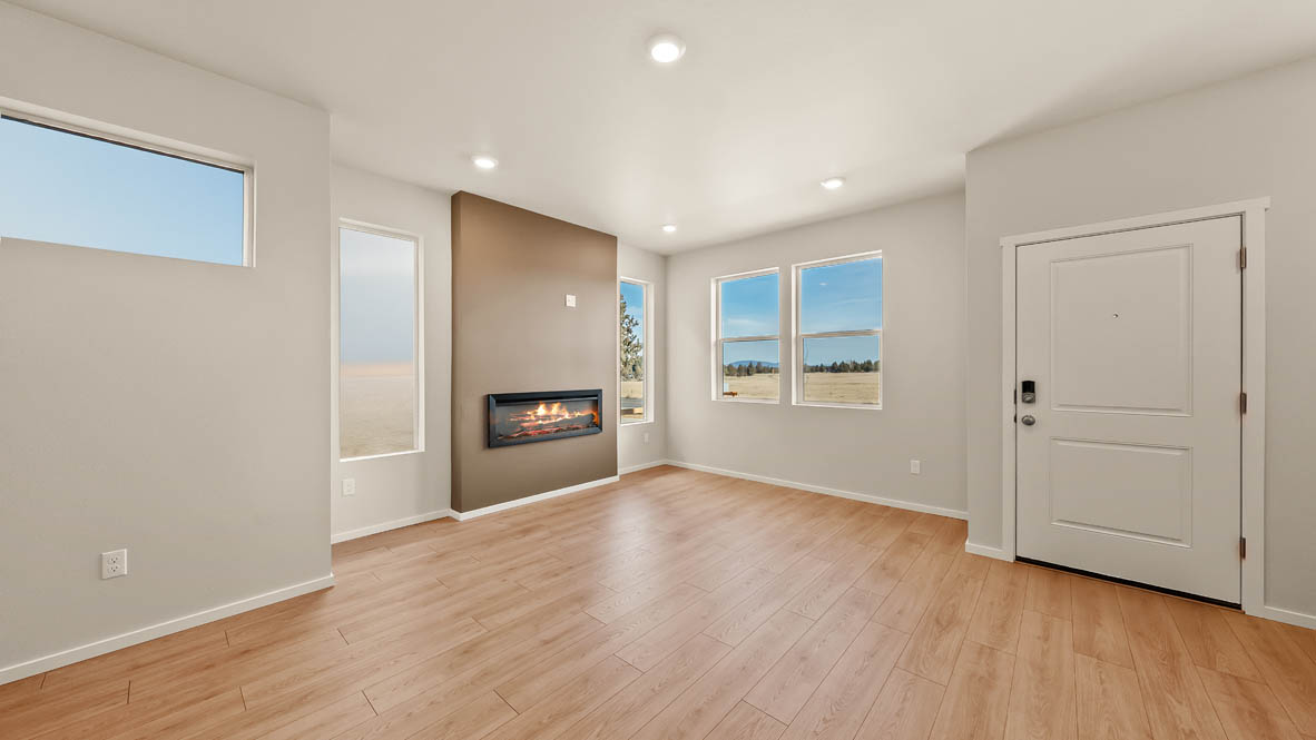 Ponderosa great room with lvt flooring and windows and fireplace