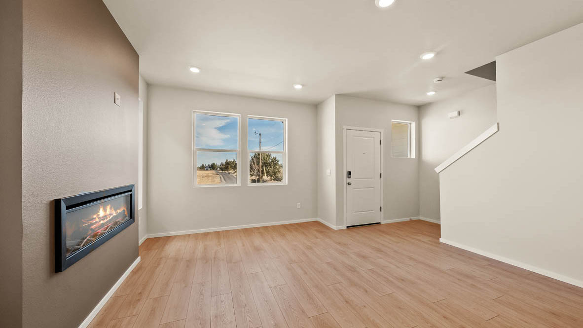 Ponderosa great room with lvt flooring and windows and fireplace