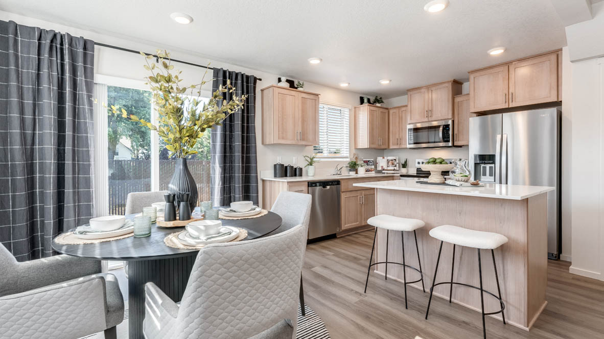 Ponderosa Dining room with a table and four chairs, kitchen with island, stainless steel appliances, dining table, quartz countertops, a cabinets