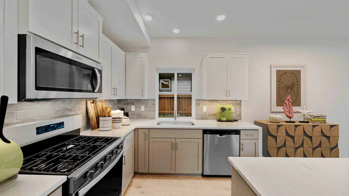 Stevens Ranch Diamond 3816 kitchen with white cabinets and stainless-steel appliances