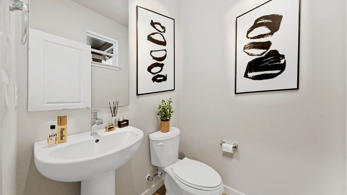 Stevens Ranch Diamond 3816 Powder bathroom with white toilet, frame mirror and hand washing station