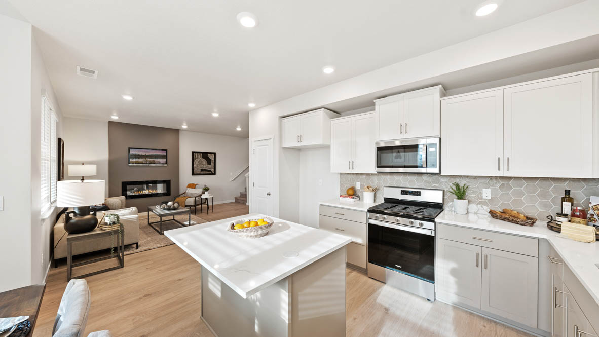 Stevens Ranch Kitchen with white quartz countertops, gray low cabinets, white upper cabinets, stainless steel appliances, window, and sink